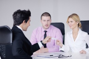 two people attend mediation with a mediator